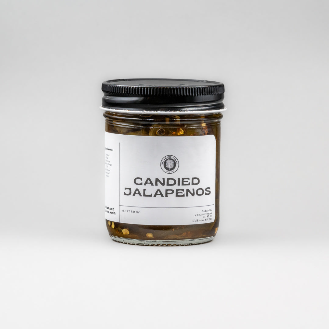 Sealed glass jar of small-batch local NY candied jalapeños by Sycamore Farms, produced by M&K Provisions.