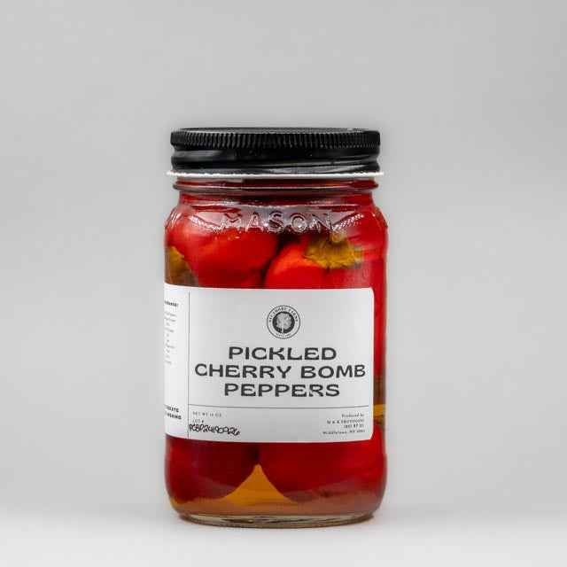 Sealed glass jar of small-batch local NY pickled peppers by Sycamore Farms, produced by M&K Provisions