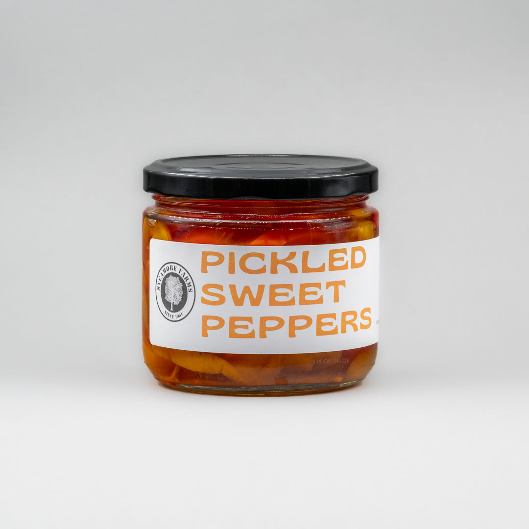 Sealed glass jar of small-batch local NY peppers by Sycamore Farms, produced by M&K Provisions