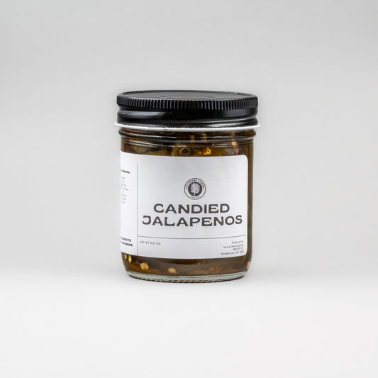 Sealed glass jar of small-batch local NY candied jalapeños by Sycamore Farms, produced by M&K Provisions.