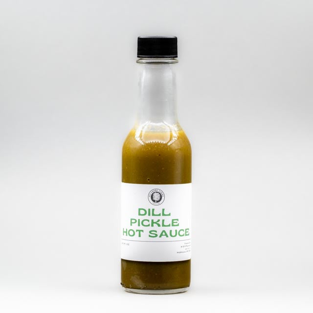 Sealed glass jar of small-batch local NY  hot sauce  by Sycamore Farms, produced by M&K Provisions