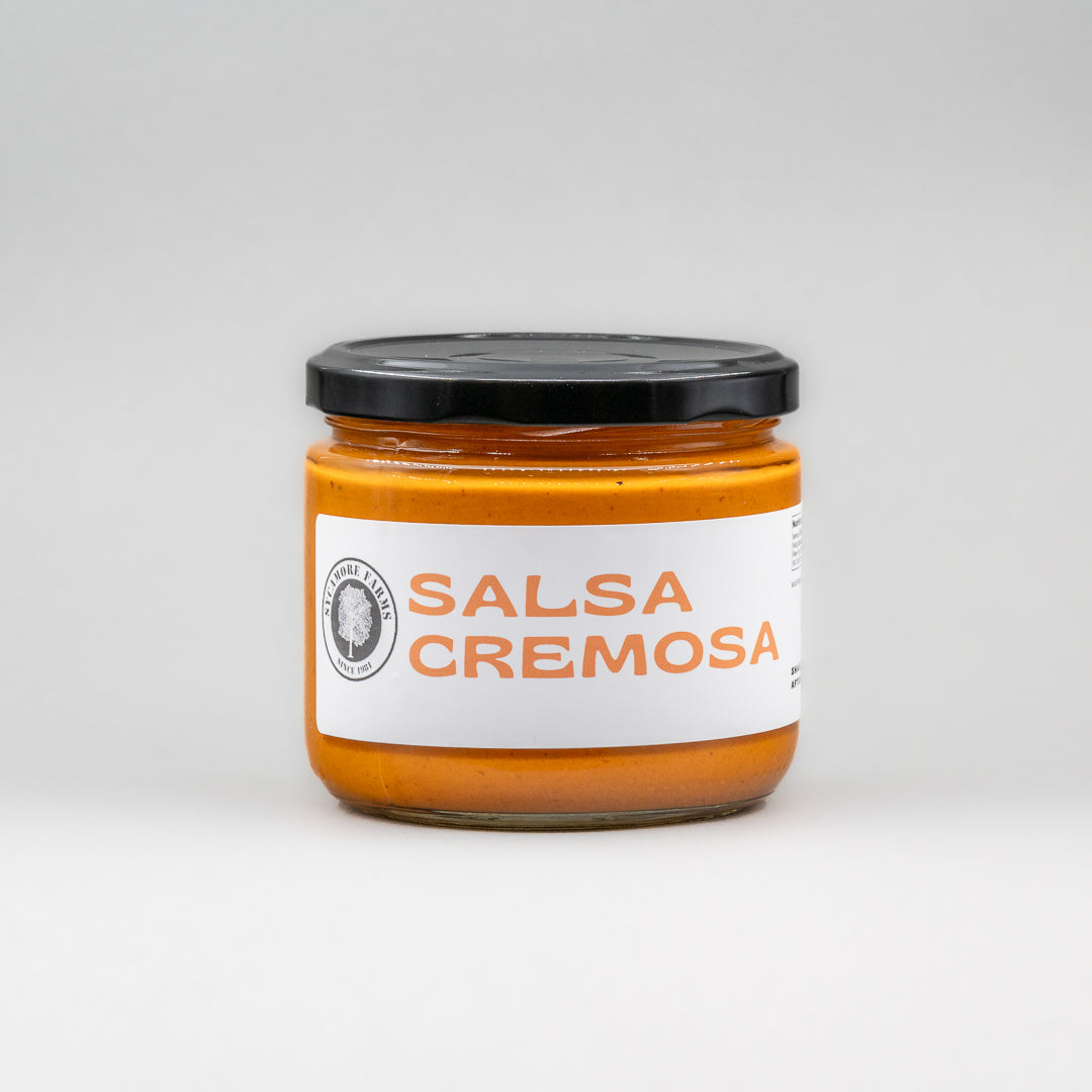 Sealed glass jar of small-batch local NY salsa cremosa by Sycamore Farms, produced by M&K Provisions