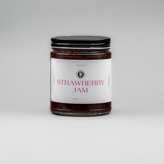 Sealed glass jar of small-batch local NY strawberry jam by Sycamore Farms, produced by M&K Provisions