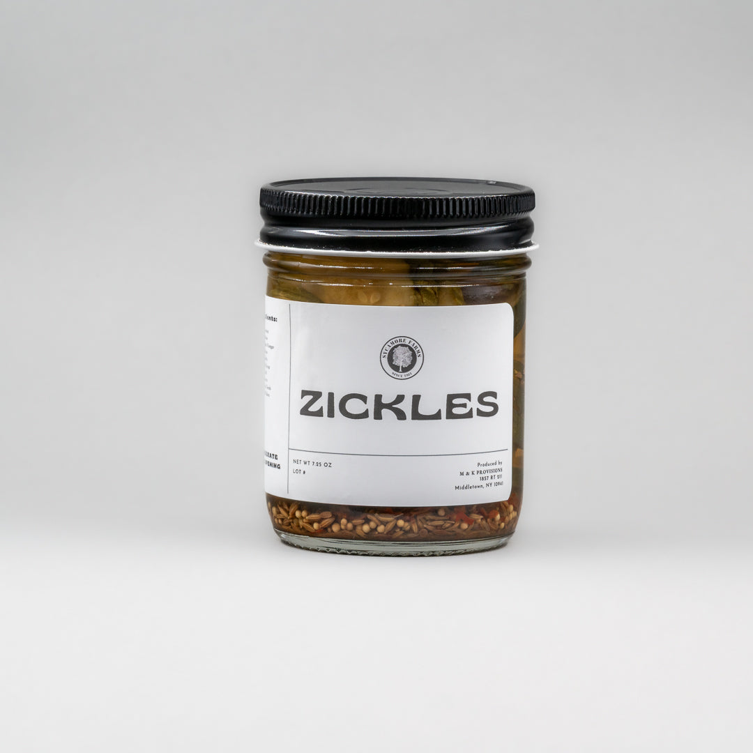 Sealed glass jar of small-batch local NY Zickles by Sycamore Farms, produced by M&K Provisions.